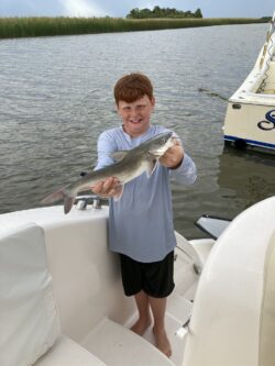 boy catching fish