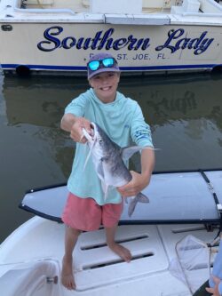 boy catching fish